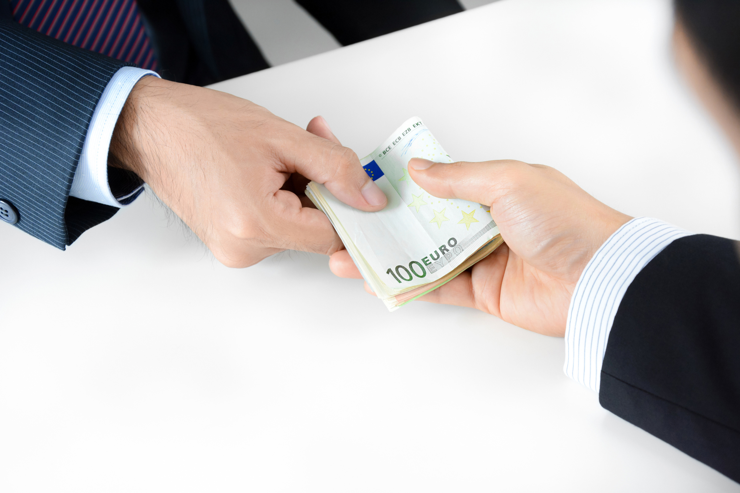 Businessman hands passing money, Euro currency (EUR)